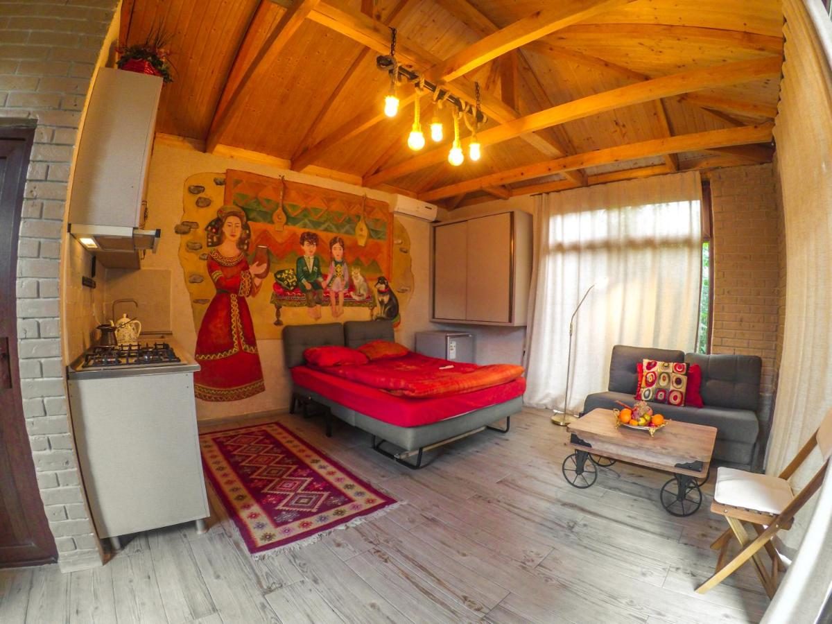 Deluxe studio with a kitchenette and a hand-painted mural
